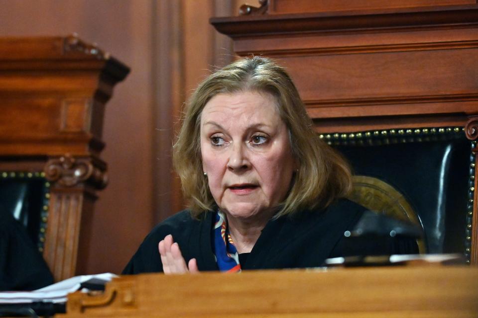 Kentucky Supreme Court Justice Lisabeth Hughes asks a question to the attorney for the American Civil Liberties Union as they hear arguments whether to temporarily pause the state's abortion ban in Frankfort, Ky., Tuesday, Nov. 15, 2022. (AP Photo/Timothy D. Easley)