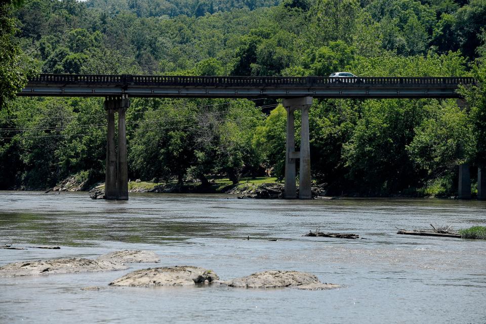 Scenes of the French Broad River June 21, 2021 from Woodfin River Park, where the Woodfin Wave will be located.