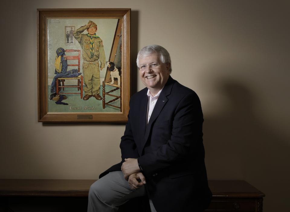 Jack Sears, CEO of Boy Scouts of America North Florida Council, poses in his Jacksonville office with a reproduction of a Norman Rockwell painting of a Scout. Sears is retiring after an almost 40-year career as a Scout executive, including leading the North Florida Council since 2007.