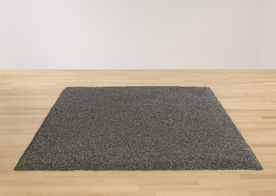 This undated photo provided by Sotheby’s New York shows "Sunflower Seeds," a sculpture by Chinese dissident artist Ai Weiwei featuring one ton of handmadeporcelain sunflower seeds. The sculpture , is slated to be auctioned by Sotheby’s on Wednesday, May 9, 2012 . The sackful of hand-painted ceramic seeds, which can be arranged in a myriad of shapes, is estimated to go for $600,000 to $800,000. (AP Photo/Sotheby’s)