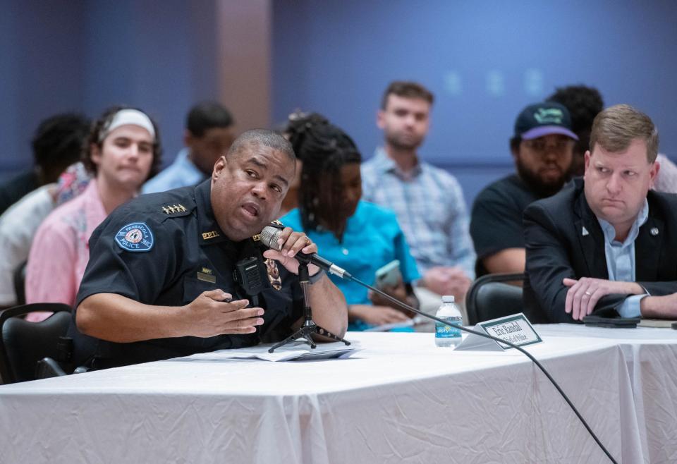 Pensacola Police Chief Eric Randall, left, speaks during an Escambia County Gun Violence Round Table hosted by Sheriff Chip Simmons at the Brownsville Community Center in Pensacola on Wednesday, Jan. 18, 2023.