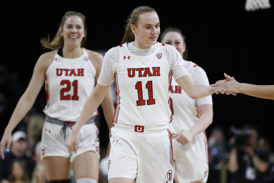 Utah's Brynna Maxwell (11) celebrates after a play gainst Washington during the second half of an NCAA college basketball game in the first round of the Pac-12 women's tournament Thursday, March 5, 2020, in Las Vegas. (AP Photo/John Locher)