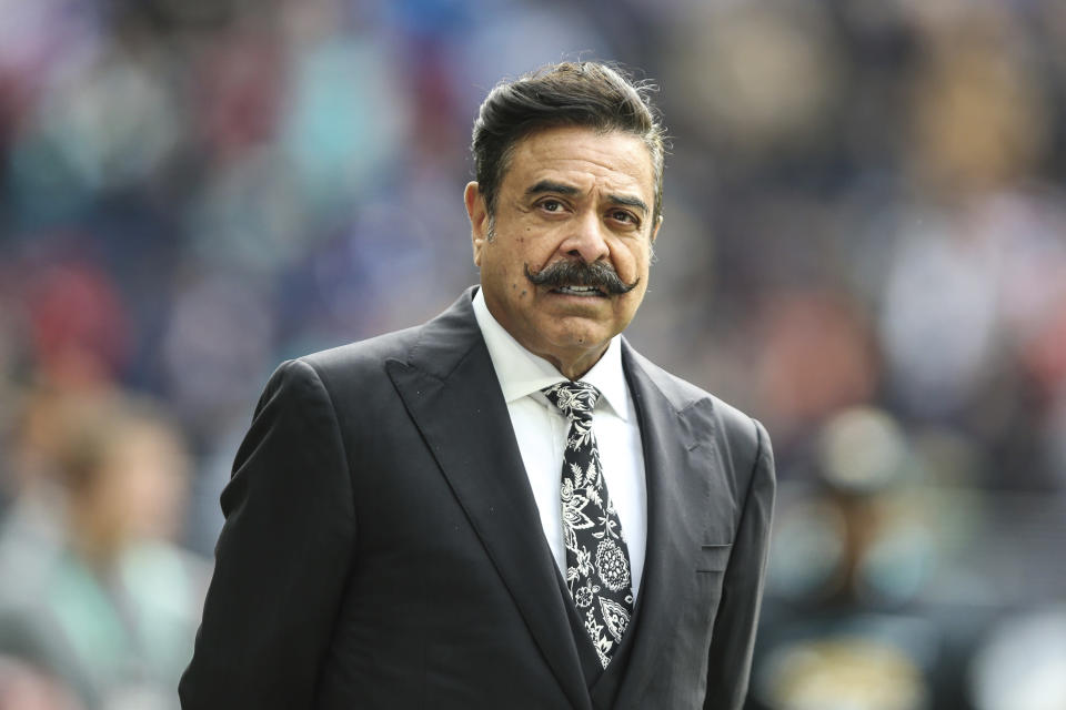 FILE - Jacksonville Jaguars owner Shad Khan is shown on the field before an NFL football game against the Miami Dolphins at Tottenham Hotspur Stadium in London, Sunday, Oct. 17, 2021. If a 40-point drubbing at New England didn’t get Jacksonville owner Shad Khan’s full attention, then what’s being planned for the team's season finale just might. Frustrated fans are revolting against the Jaguars and have Khan in their crosshairs. (AP Photo/Gary McCullough, File)