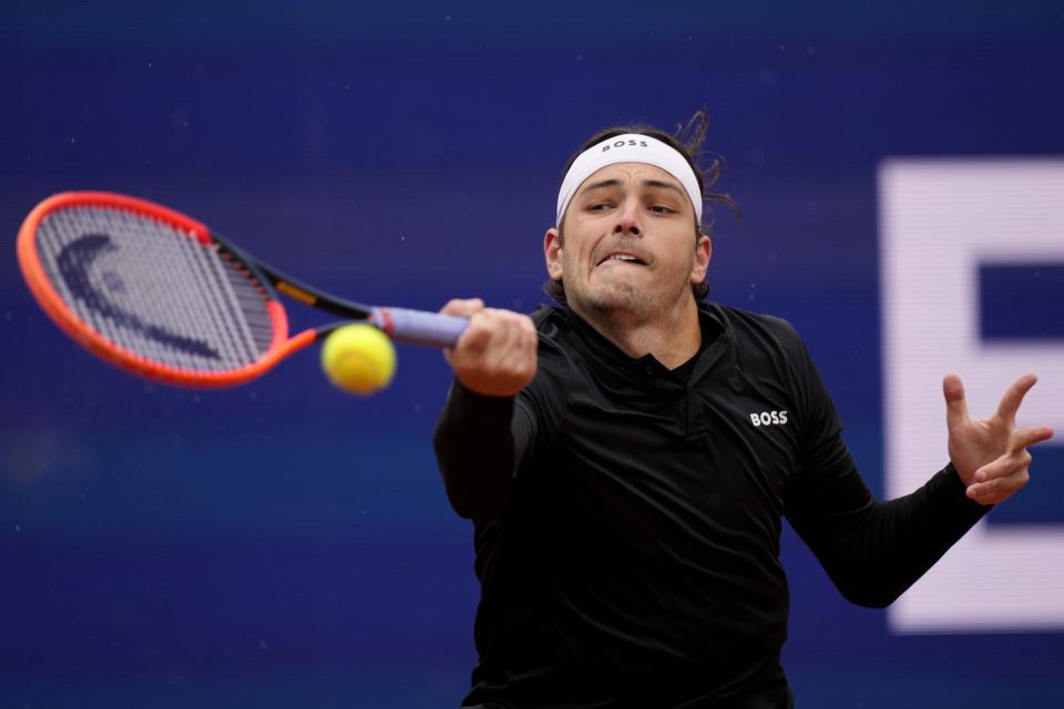 Taylor Fritz of the United States returns the ball during the final match against Jan-Lennard Struff of Germany at the Tennis ATP tournament in Munich, Germany, Sunday, April 21, 2024. (AP Photo/Matthias Schrader)