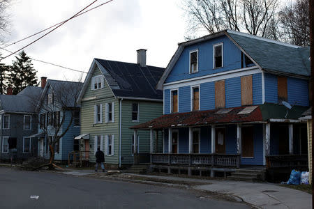 A man walks along Winding Way in Binghamton, New York, U.S., April 8, 2018. REUTERS/Andrew Kelly