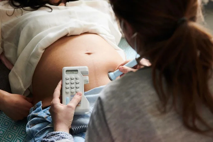 A pregnant person receives an ultrasound