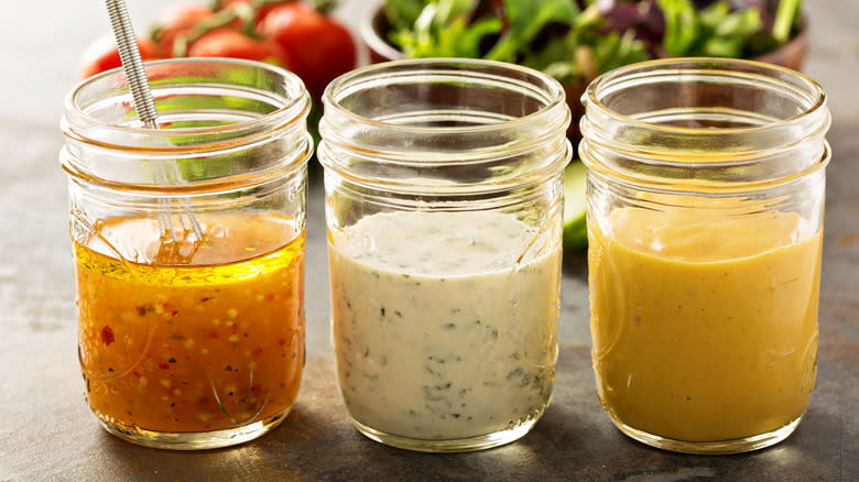 three jars of salad dressing