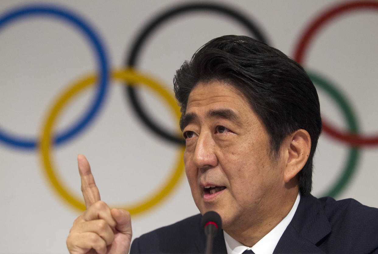 FILE - Then Japan's Prime Minister Shinzo Abe gestures during a news conference at the 125th International Olympic Committee session in Buenos Aires, Argentina on Sept. 7, 2013. Former Prime Minister Shinzo Abe was the country’s central figure in landing the 2020 Olympics for Tokyo. Abe died after being shot while campaigning in western Japan on July 8, 2022.(AP Photo/Ivan Fernandez, File)