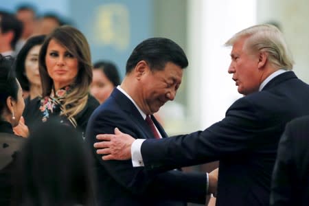 China's President Xi Jinping, first lady Peng Liyuan, U.S. President Donald Trump and first lady Melania attend a state dinner at the Great Hall of the People in Beijing