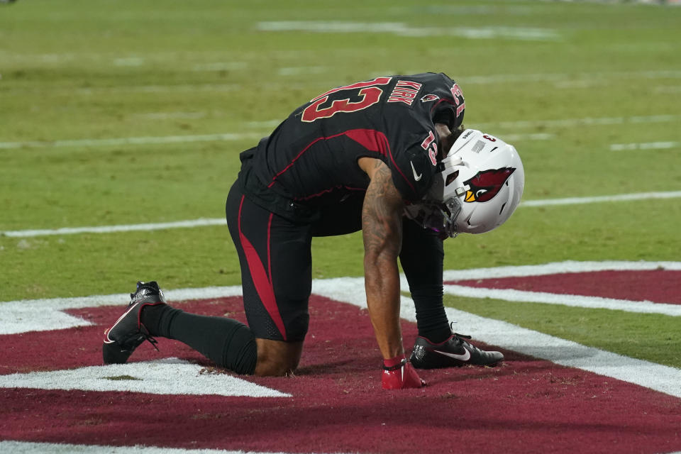 Arizona Cardinals wide receiver Christian Kirk kneels in the end zone after a turnover during the second half of an NFL football game against the Green Bay Packers, Thursday, Oct. 28, 2021, in Glendale, Ariz. The Packers won 24-21. (AP Photo/Rick Scuteri)