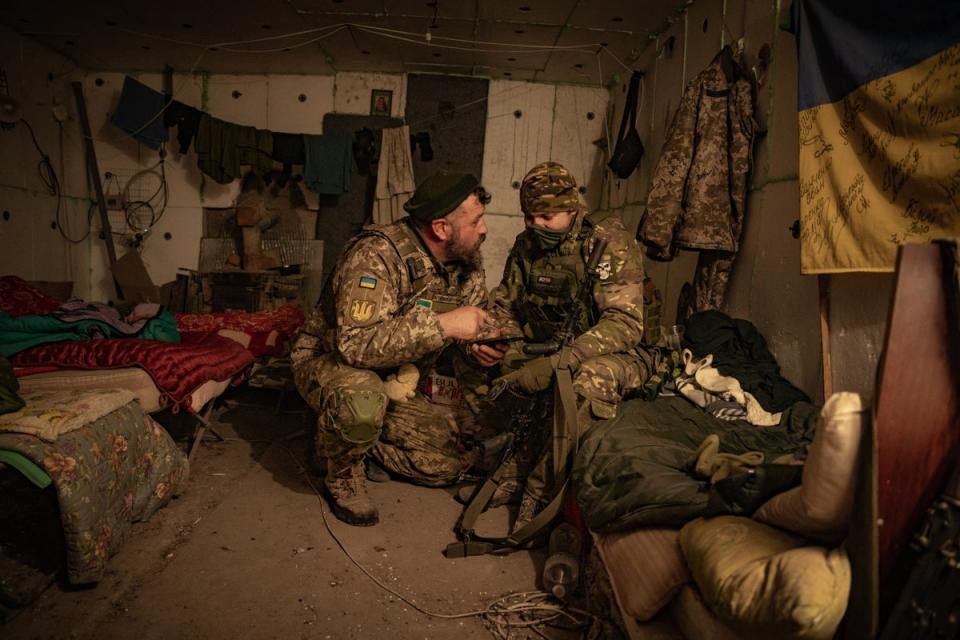 Infantry soldiers discuss an upcoming counteroffensive in a bunker near Orikhiv (Bel Trew)