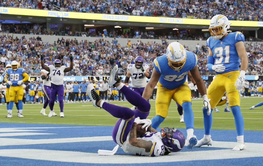 Inglewood, CA, Sunday, November 14, 2021 - Minnesota Vikings tight end Tyler Conklin (83) catches a touchdown pass over Los Angeles Chargers defensive end Jerry Tillery (99) on a third quarter drive at SoFi Stadium. Robert Gauthier/Los Angeles Times)