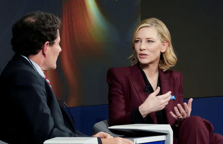 Cate Blanchett, Goodwill Ambassador, United Nations High Commissioner for Refugees (UNHCR), and Nicholas D. Kristof, Columnist at New York Times, speak during the World Economic Forum (WEF) annual meeting in Davos, Switzerland January 23, 2018 REUTERS/Denis Balibouse