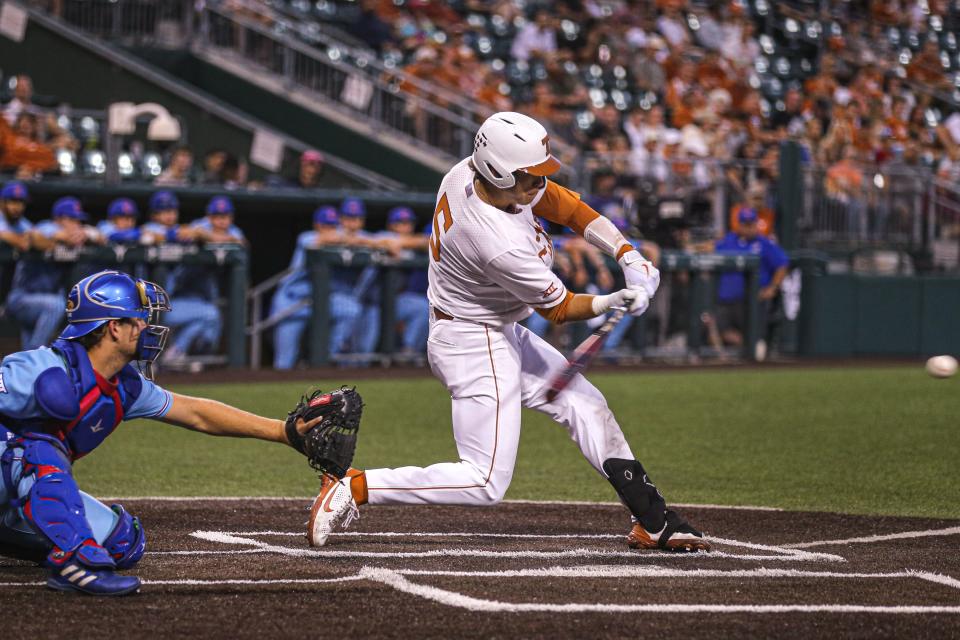 Texas infielder Skyler Messinger swings at a ball during the game against Kansas at UFCU Disch-Falk Field on Thursday. He hit a grand slam against his former team Saturday to help Texas secure the series sweep.