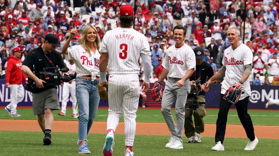 Kaitlin Olson (far left), McElhenney (second from right), former Philadelphia Phillies second baseman Chase Utley (far right) and Harper participate in opening ceremonies. - Vera Nieuwenhuis/AP