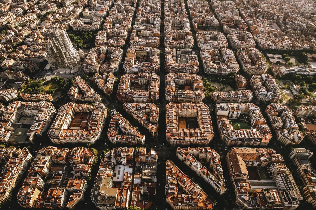 Aerial view of the residential Eixample district of Barcelona, with the Sagrada Familia, Designed by Catalan architect Antoni Gaudi