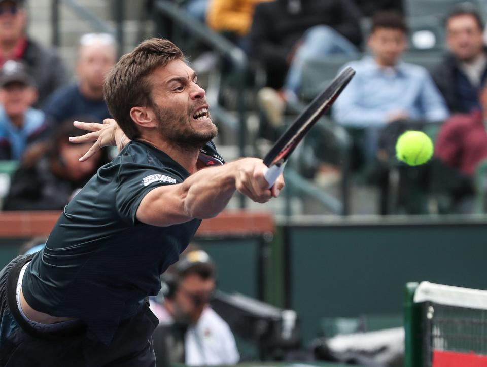 Nikola Mektic reaches for a shot while playing during his win in the doubles finals at the BNP Paribas Open in Indian Wells, Calif., March15, 2024.