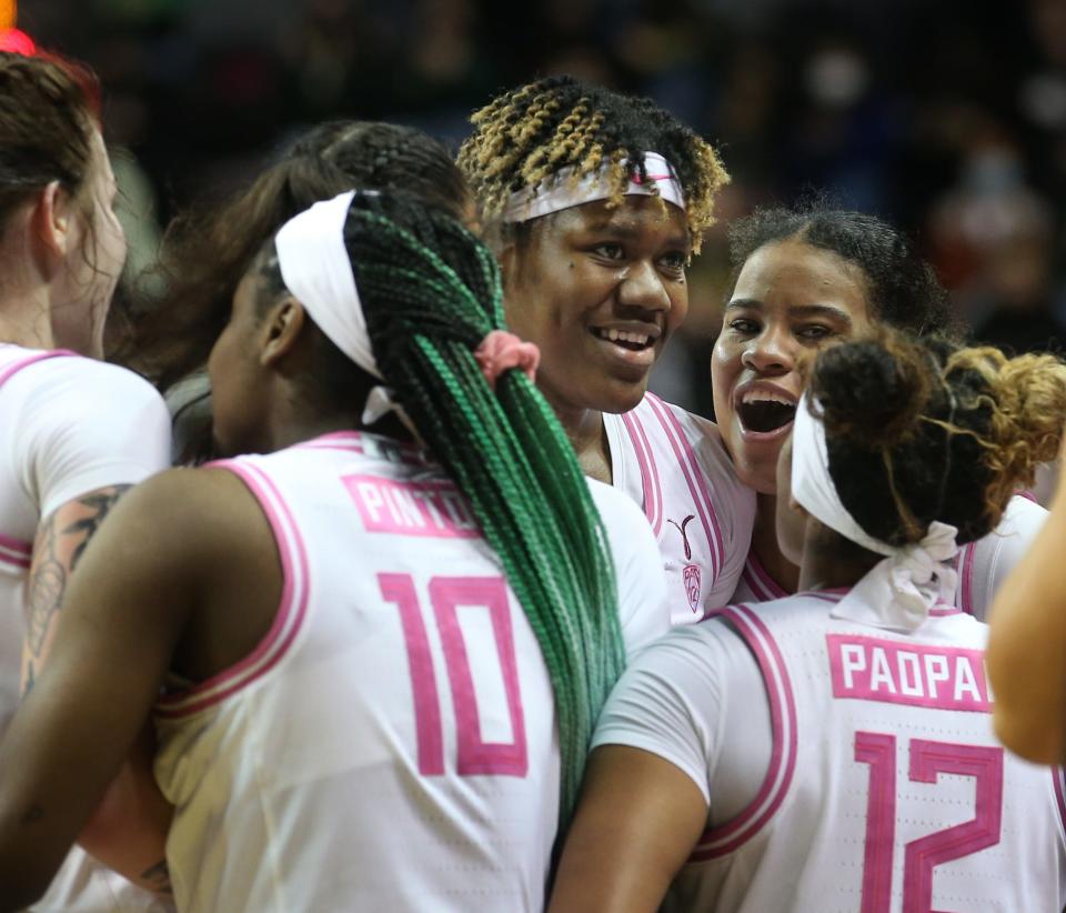 Oregon's Phillipina Kyei, center, is congratulated by her teammates during the second half against California Feb. 18, 2022.