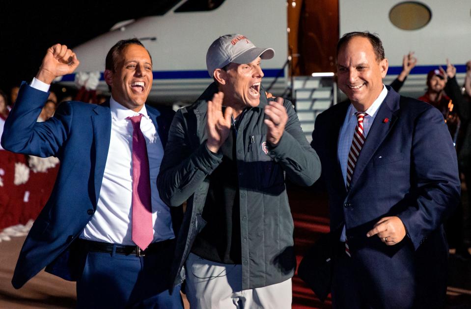 OU president Joseph Harroz (left) and athletic director Joe Castiglione (right) landed new football coach Brent Venables on Sunday.