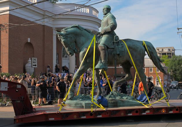 A statue of Confederate Gen. Robert E Lee located in Charlottesville, Virginia, is transported away after being removed from Market Street Park in July. (Photo: The Washington Post via Getty Images)