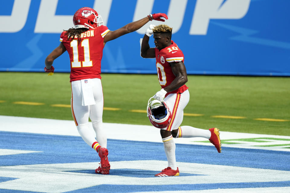 Kansas City Chiefs wide receiver Tyreek Hill, right, celebrates his touchdown catch with wide receiver Demarcus Robinson (11) during the second half of an NFL football game against the Los Angeles Chargers Sunday, Sept. 20, 2020, in Inglewood, Calif. (AP Photo/Ashley Landis)