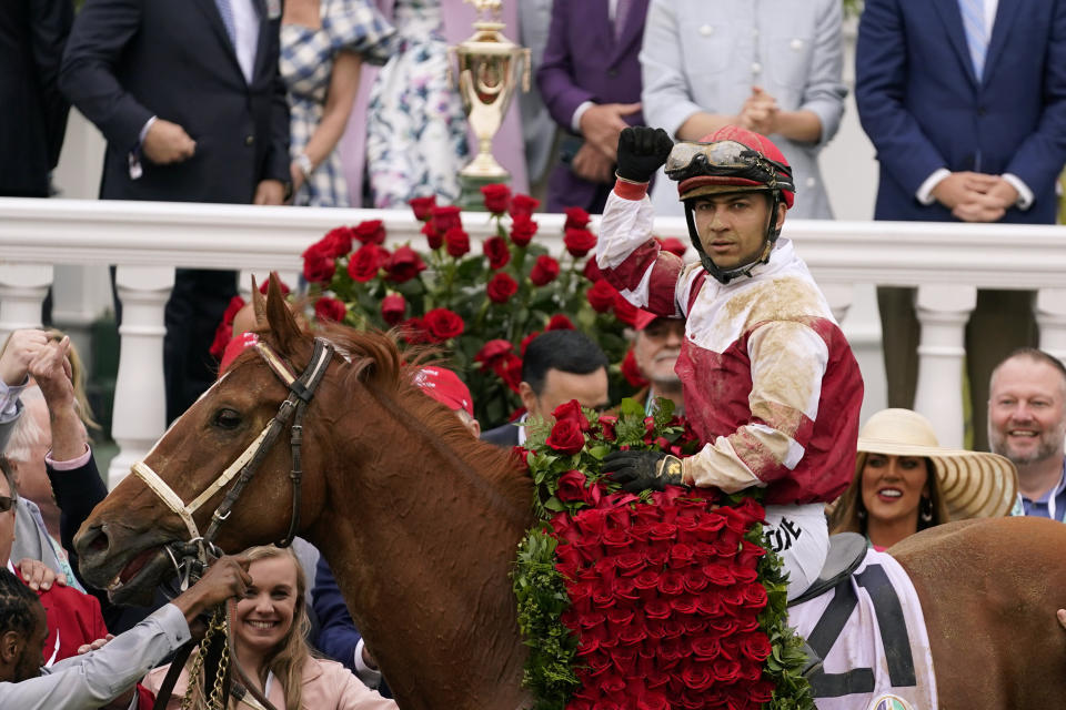 Jockey Sonny Leon rides Rich Strike in the winner's circle after winning the 148th running of the Kentucky Derby horse race at Churchill Downs Saturday, May 7, 2022, in Louisville, Ky. (AP Photo/Jeff Roberson)