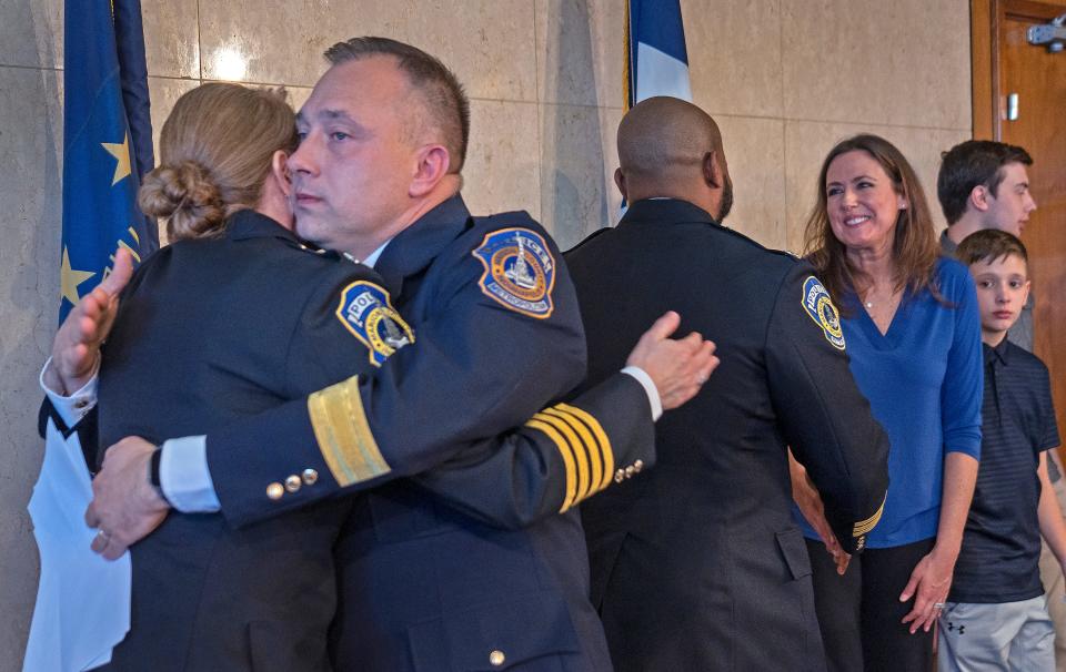 Newly-appointed IMPD Assistant Chief Catherine Cummings, left, congratulates new Chief of the Indianapolis Metropolitan Police Department Christopher Bailey after he was sworn in Monday, Feb. 12, 2024 during a press conference at the City/County Building.