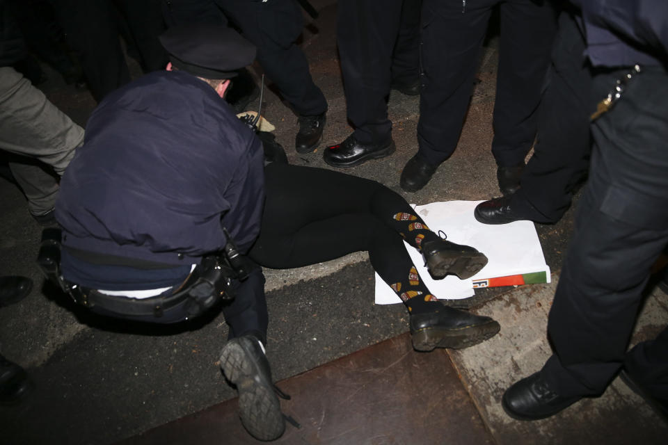 A protestor is arrested during a march against a grand jury's decision not to indict the police officer involved in the death of Eric Garner, Friday, Dec. 5, 2014, in New York.  (AP Photo/John Minchillo)
