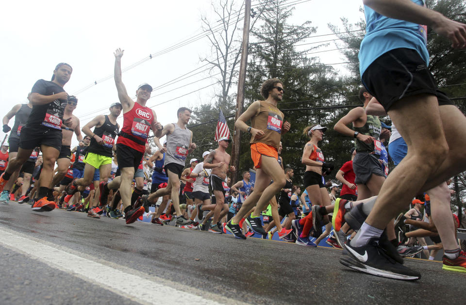 Peter Guza, of North Andover, Mass., waves as he starts the 123rd Boston Marathon on Monday, April 15, 2019, in Hopkinton, Mass. (AP Photo/Stew Milne)