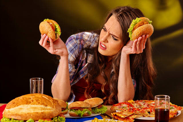 Girl eating big sandwich