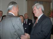 FILE - U.S. House Speaker Newt Gingrich, right, speaks with Taiwanese President Lee Teng-hui at a meeting in Lee's office in Taipei Wednesday, April 2, 1997. In 1997, Beijing grumbled but swallowed its irritation when Gingrich visited Taiwan. A quarter-century later, news reports that the current speaker, Nancy Pelosi, might visit Taiwan, Beijing is warning of “forceful measures” including military action if she does.(AP Photo/Eddie Shih, Pool, File