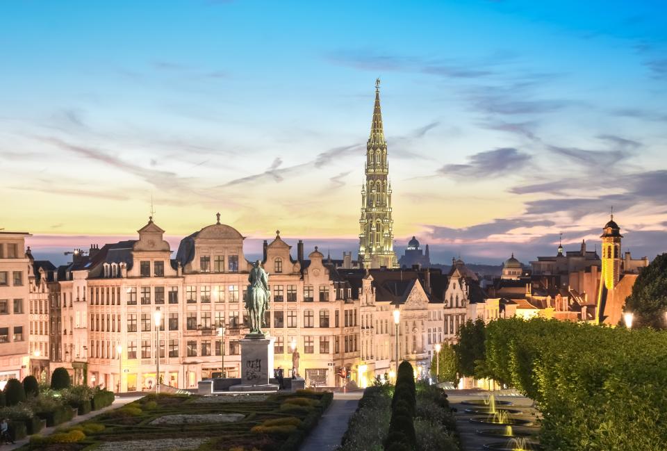 <h1 class="title">Brussels skyline at dusk with majestic City Hall bell tower in Gothic style illuminated with romantic sky, Brussels, Belgium</h1><cite class="credit">Photo: Sir Francis Canker Photography / Getty Images</cite>