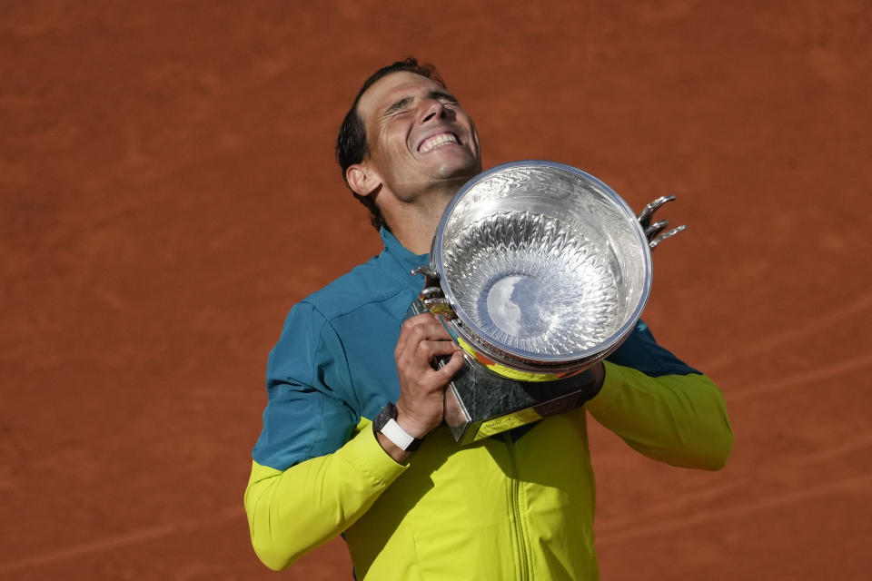 FILE - Spain's Rafael Nadal lifts the trophy after winning the final match against Norway's Casper Ruud in three sets, 6-3, 6-3, 6-0, at the French Open tennis tournament in Roland Garros stadium in Paris, France, Sunday, June 5, 2022. (AP Photo/Christophe Ena, File)