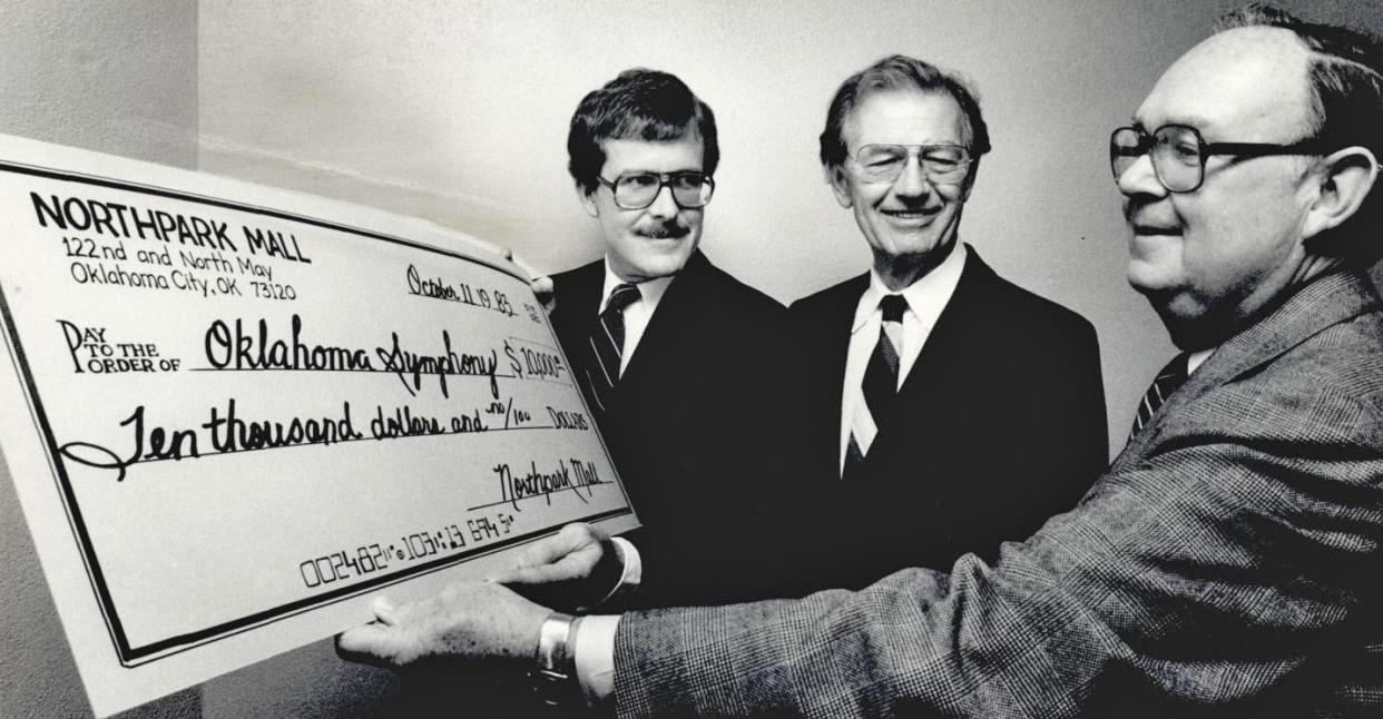 A giant check with a giant amount is presented to Richard L. Sias, right, of the Oklahoma Symphony Orchestra board of directors, from the Northpark Mall Merchants Association in this photo from October 1983. The mall is celebrating its 50th anniversary this year.