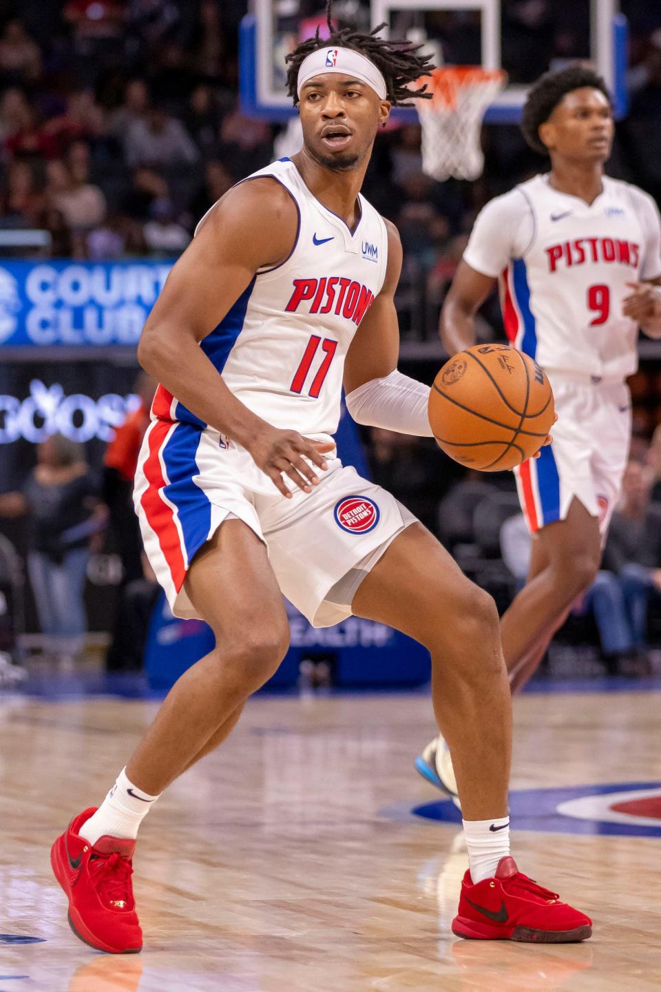 Detroit Pistons guard Stanley Umude controls the ball against the Phoenix Suns during the second half of a preseason game at Little Caesars Arena, Sunday, Oct. 8, 2023.