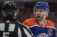 Edmonton Oilers' Connor McDavid (97) argues with a referee during the second period of Game 3 of an NHL hockey Stanley Cup second-round playoff series against the Vancouver Canucks in Edmonton, Alberta, Sunday, May 12, 2024. (Jason Franson/The Canadian Press via AP)