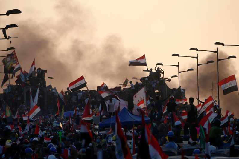 Iraqi demonstrators attend an anti-government protest in Baghdad