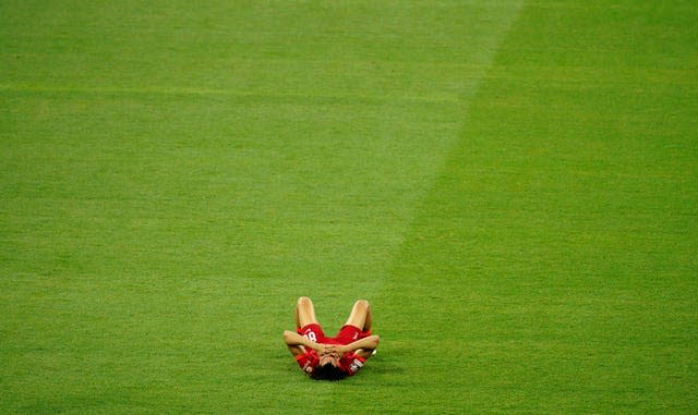 Trent Alexander-Arnold lies on the pitch