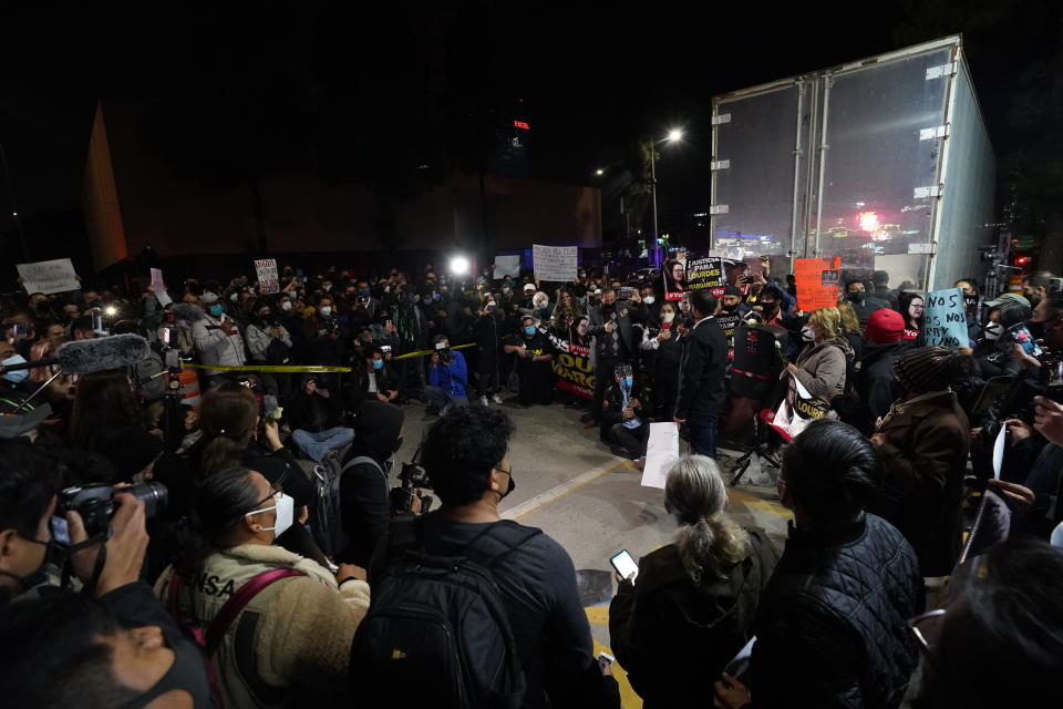 People and journalists join a national protest against the murder of journalist Lourdes Maldonado and freelance photojournalist Margarito Martínez, outside the attorney general's office in Tijuana, Mexico, Tuesday, Jan. 25, 2022. Mexico's Interior Undersecretary Alejandro Encinas said recently that more than 90% of murders of journalists and rights defenders remain unresolved, despite a government system meant to protect them. (AP Photo/Marco Ugarte)