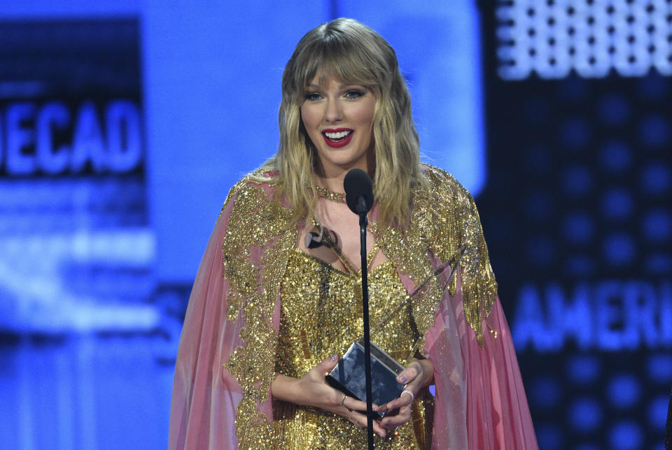 Taylor Swift accepts the award for artist of the decade at the American Music Awards on Sunday, Nov. 24, 2019, at the Microsoft Theater in Los Angeles. (Photo by Chris Pizzello/Invision/AP)