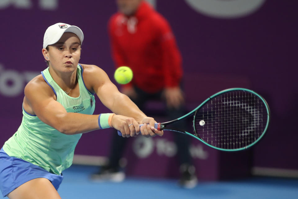 Ashleigh Barty of Australia returns the ball to Garbine Muguruza of Spain during a quarter-final match at the Qatar Total Open tournament in Doha, on February 27, 2020. (Photo by KARIM JAAFAR / AFP) (Photo by KARIM JAAFAR/AFP via Getty Images)