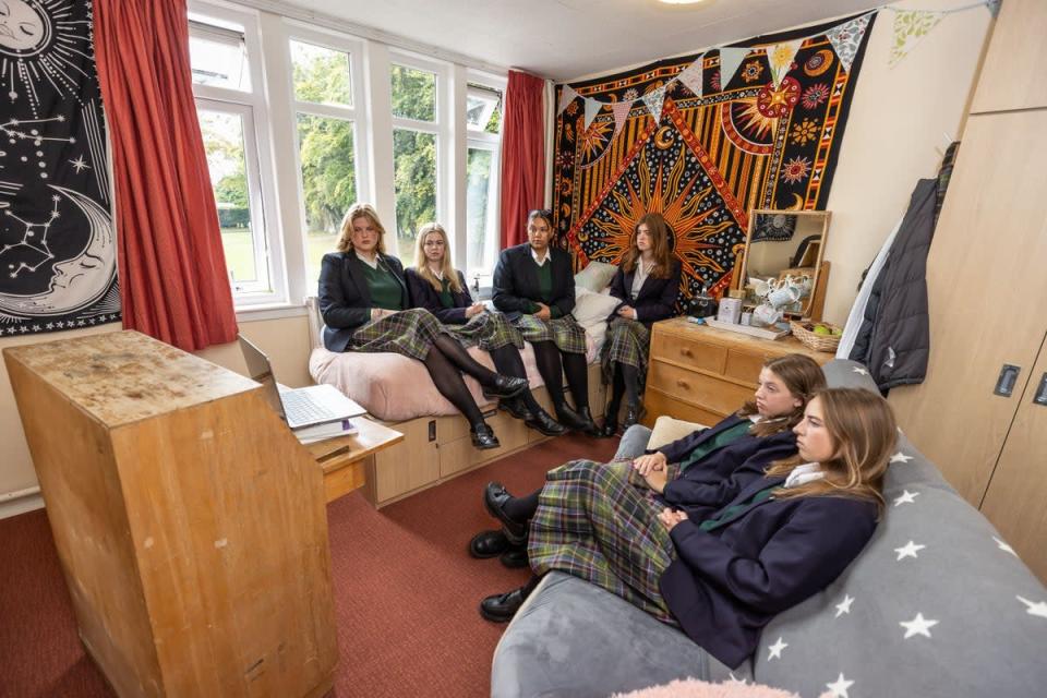 Students watch the funeral in their boarding house, Windmill Lodge, at Gordonstoun (Paul Campbell/PA) (PA Wire)