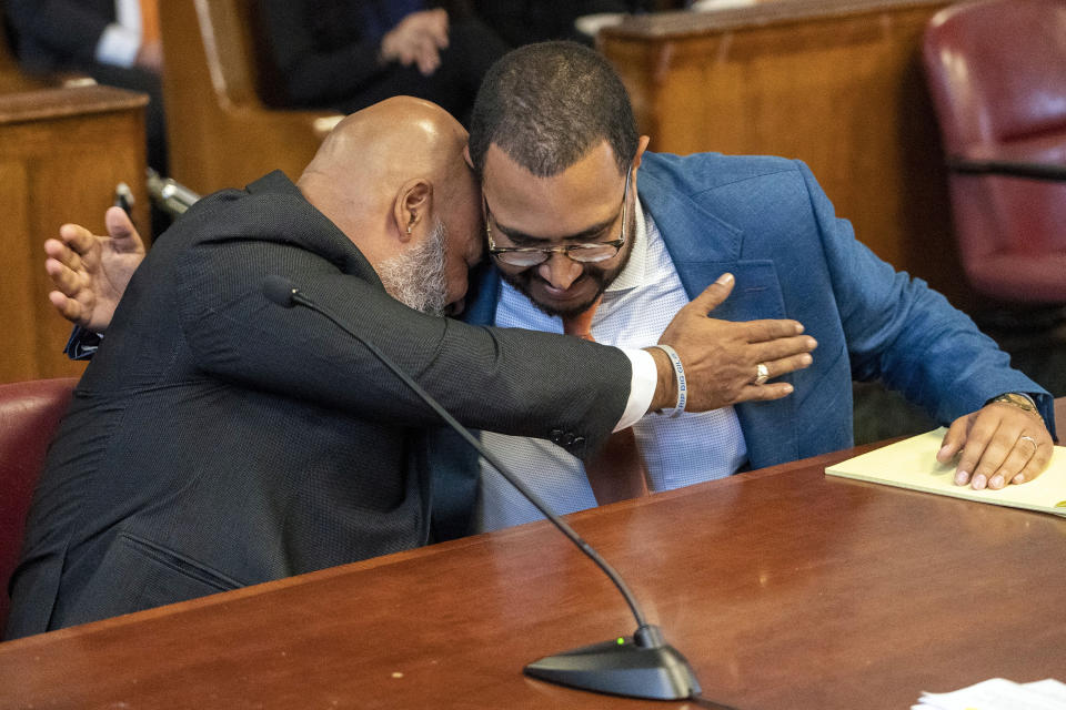 Steven Lopez, right, hugs his lawyer Eric Renfroe during a court hearing, Monday, July 25, 2022, in New York. Lopez, a co-defendant of the so-called Central Park Five, whose convictions in a notorious 1989 rape of a jogger were thrown out more than a decade later, had his conviction on a related charge overturned Monday. (Steven Hirsch/New York Post via AP, Pool)