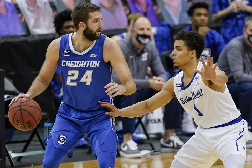 Seton Hall's Bryce Aiken (1) defends Creighton's Mitch Ballock (24) during the second half of an NCAA college basketball game Wednesday, Jan. 27, 2021, in Newark, N.J. Creighton won 85-81. (AP Photo/Frank Franklin II)