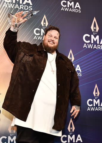 <p>Scott Kirkland/Disney via Getty</p> Jelly Roll with his CMA Award in Nashville on Nov. 8, 2023