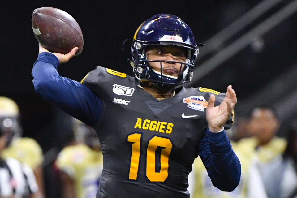 North Carolina A&T quarterback Kylil Carter (10) passes during first half of the Celebration Bowl NCAA college football game against Alcorn State, Saturday, Dec. 21, 2019, in Atlanta. (John Amis/Atlanta Journal-Constitution via AP)