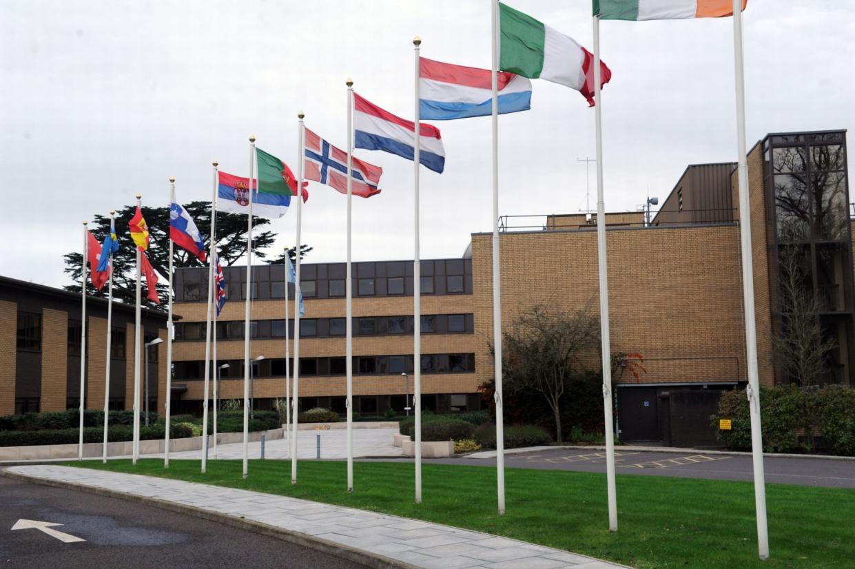 The ECMWF building, in Reading, is seen bearing the flags of all its member states (Facebook)