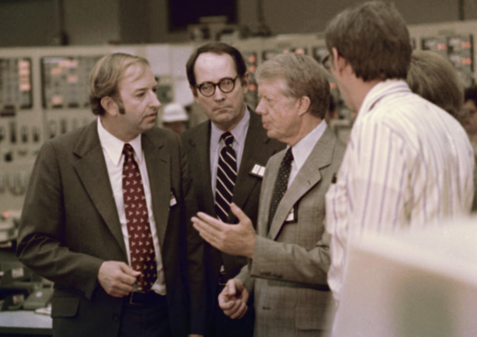 FILE - In this April 1, 1979, file photo President Jimmy Carter talks in the control room of Three Mile Island nuclear plant in Middletown, Pa., with from left, Harold Denton, Director of the U.S. Nuclear Agency, Pennsylvania Gov. Dick Thornburgh, and an unidentified control room employee. Thornburgh died Thursday, Dec. 31, 2020 at a retirement community facility outside Pittsburgh, his son David said. (AP Photo, File)