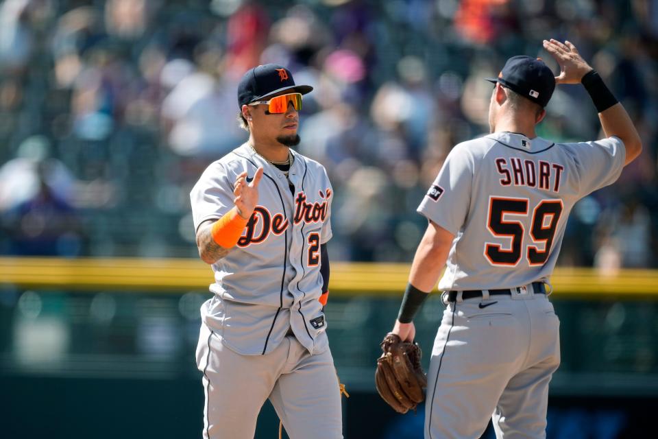 Detroit Tigers shortstop Javier Baez, left, celebrates with second baseman Zack Short after a baseball game against the Colorado Rockies at Coors Field in Denver on Sunday, July 2, 2023.