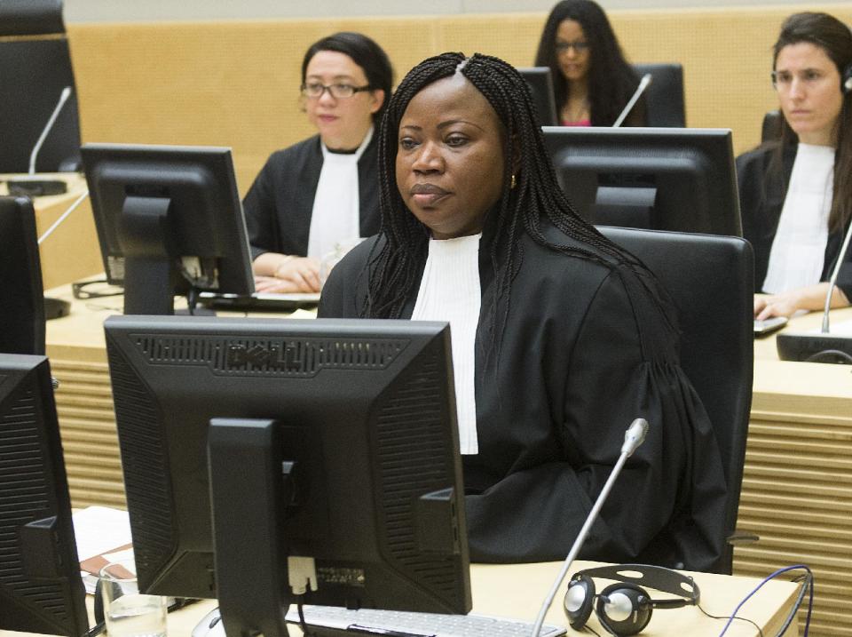Prosecutor Fatou Bensouda, front, awaits the start of a hearing at the International Criminal Court (ICC) in The Hague, Netherlands, Monday Feb. 10, 2014. Judges at the ICC are weighing whether there is enough evidence to proceed to trial in the case against Bosco Ntaganda, the former leader of a rebel group in Congo’s unstable eastern region. Prosecutor Bensouda accused Ntaganda of 13 charges of war crimes and 5 charges of crimes against humanity for acts including murder, rape, persecution and recruiting child soldiers. Ntaganda's lawyers have said he is innocent of any wrongdoing. (AP Photo/Toussaint Kluiters, Pool)